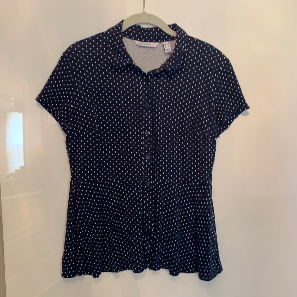 Navy and white polka-dot flared bottom top.